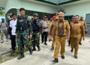 Sinergitas Satgas Yonif 721/Mks Bersama Forkopimda Sambut Kunjungan Kerja Pj Gubernur Papua Pegunungan di Tolikara