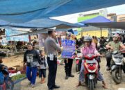 Personil Satlantas Polres Pelalawan Sampaikan Pesan Kamtibmas dan Cooling System Pilkada Damai 2024 di Pasar Ukui